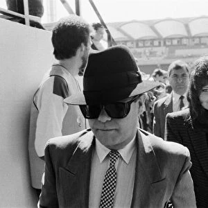 Elton John and his wife Renate arriving to watch his team, Watford, play a football match