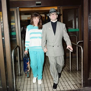 Elton John and his wife Renate at London Airport. 29th July 1988