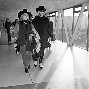 Elton John and Zandra Rhodes at Heathrow. 11th January 1981
