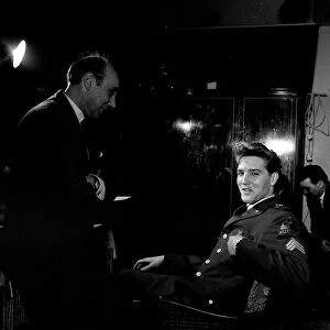 Elvis Presley at a press conference in Germany March 1960 with Mirror writer Donald Zec