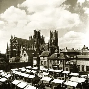 Ely Cathedral Cambridgeshire over looking the town square on a market day