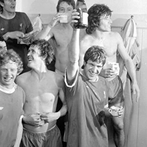 Emlyn Hughes, Kevin Keegan and other members of the Liverpool team celebrate in