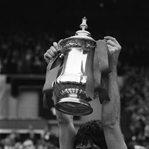 Emlyn Hughes Liverpool captain holds up the FA Cup 1974 at Wembley after Liverpool