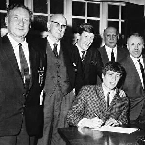Emlyn Hughes signs for Liverpool FC February 1967 watched by Bill Shankly second