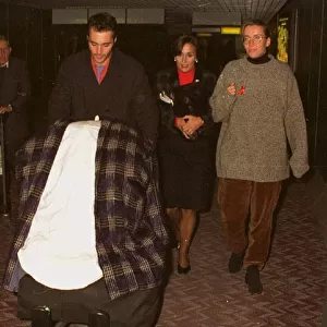 Emma Thompson and Greg Wise arriving at Heathrow airport from Los Angeles