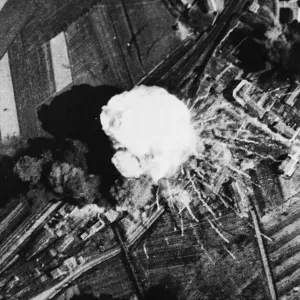 An enemy ammunition train goes up in a puff of white smoke when hit directly in a bombing