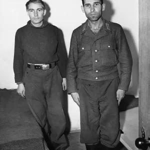 Engelbert Nadermayer (right) who was formerly in charge of the notorious crematorium at Dachau, shown in his cell alongside a former SS trooper who is also on the list of war criminals to be tried. 20th September 1945