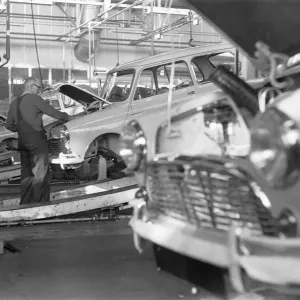 The engine bay on a Austin Mini is prepared to receive its engine on the production line The engine bay on a Austin Mini is prepared to receive its engine on the production line