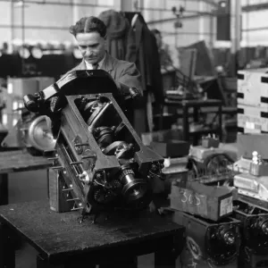Engines being assembled at the Triumph car factory in Coventry. 23 September 1931 Engines being assembled at the Triumph car factory in Coventry. 23 September 1931