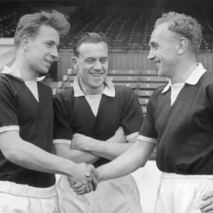 England captain Billy Wright (right) shakes hands with new recruit Bobby Charlton of England captain Billy Wright (right) shakes hands with new recruit Bobby Charlton of