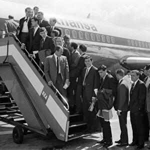 The England football team board their plane as they leave London airport for Frankfurt