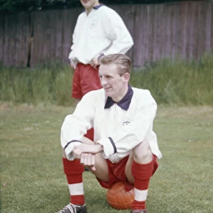 England football team training. George Eastham sitting down, watched by Roger Hunt