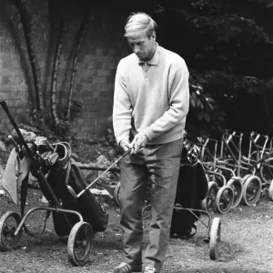 England footballer Bobby Charlton chosses his club as enjoys a round of golf during an England footballer Bobby Charlton chosses his club as enjoys a round of golf during an