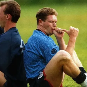 England footballer Paul Gascoigne joking and sucking his thumb as he sits back to back