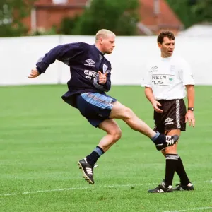 England footballer Paul Gascoigne practices his shooting during a training session