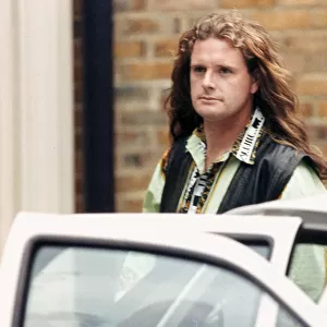 England footballer Paul Gascoigne walks out of a crimper