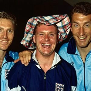 England footballer Paul Gascoigne wearing a tartan hat poses with teammates Gary Stevens