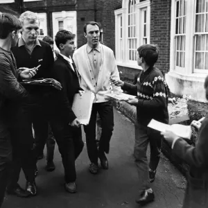 England footballers Bobby Moore and Jimmy Greaves are beseiged by young autograph hunters England footballers Bobby Moore and Jimmy Greaves are beseiged by young autograph hunters