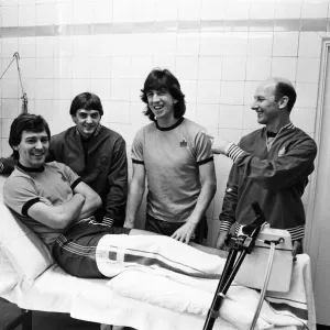 England player sat the treatment table - skipper Bryan Robson gets the attention of Fred