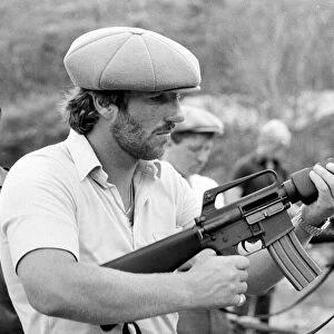 England in West Indies 1981. Ian Botham with the England team trying out some guns