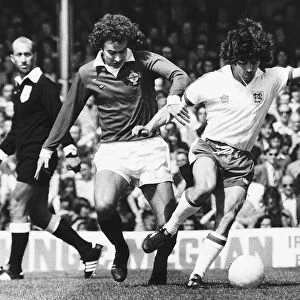 Englands Kevin Keegan shrugs off a tackle from a Northern Irelands Martin O