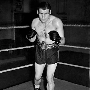 English middleweight boxer Vince Hawkins wearing his belt