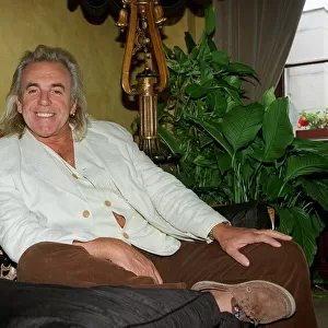 English nightclub owner Peter Stringfellow at home relaxing. September 1998