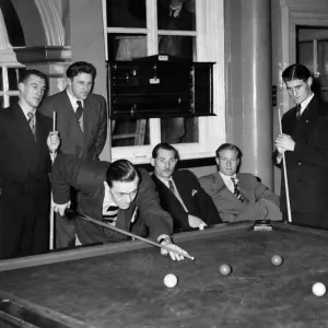 Some of the English team playing billiards does not seem to notice the decorator Mr Some of the English team playing billiards does not seem to notice the decorator Mr