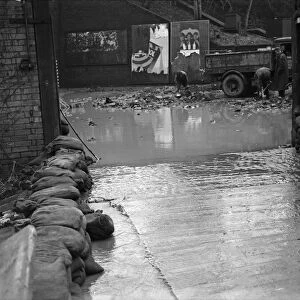 The entrance to the Cadbury factory at Bournville as workmen clean up after flooding