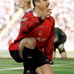 Eric Cantona of Manchester United celebrates his goal against Blackburn Rovers at Ewood