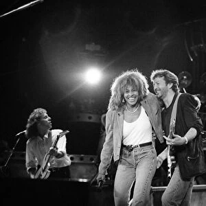 Eric Clapton in concert with American singer Tina Turner June 1987