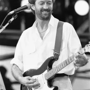 Eric Clapton performing on stage at the John F. Kennedy Stadium, Philadelphia Eric Clapton performing on stage at the John F. Kennedy Stadium, Philadelphia