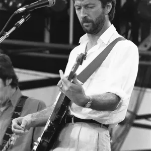 Eric Clapton performing on stage at the John F. Kennedy Stadium, Philadelphia Eric Clapton performing on stage at the John F. Kennedy Stadium, Philadelphia