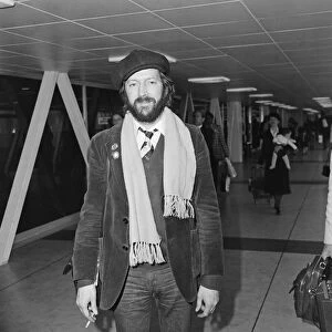 Eric Clapton pictured leaving Heathrow airport for California