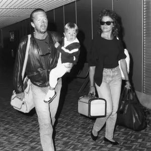 Eric Clapton singer songwriter and girlfriend Lori Del Santo walk through airport with Eric Clapton singer songwriter and girlfriend Lori Del Santo walk through airport with