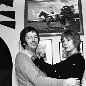 Eric Clapton and wife Pattie, pictured in front of a photograph of his racehorse Via