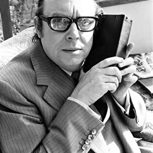 Eric Morecambe, Comedian & Luton FC Director, listens to match report on the radio