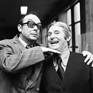 Eric Morecambe and Ernie Wise, still able to enjoy a laugh as they take a break