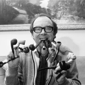 Eric Morecambe Print, a photograph of the comedian with his pipes at home