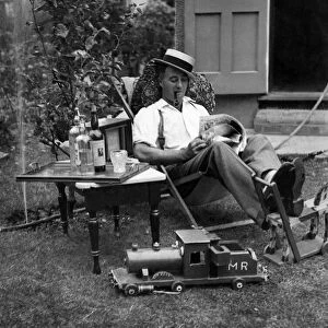 Ernest Barnes of Motspur Park, New Malden, relaxes at home in his garden