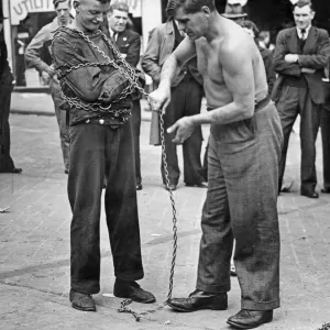 Escapologist in the Birmingham Bull Ring Print, 30th July 1947 Escapologist in the Birmingham Bull Ring Print, 30th July 1947