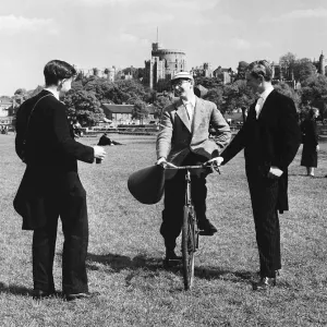 Eton scholars in uniform on the banks of the Thames Circa 1955 Eton scholars in uniform on the banks of the Thames Circa 1955