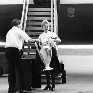 The European Cup in the safe hands of a British Airways stewardess at Speke Airport as