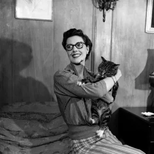 Eve Wynn. Mannequin who wears glasses and looks glamorous seen here with her pet cat Eve Wynn. Mannequin who wears glasses and looks glamorous seen here with her pet cat