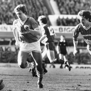 Everton footballer Kevin Sheedy on the ball chased by Mark Lawrenson during the English Everton footballer Kevin Sheedy on the ball chased by Mark Lawrenson during the English