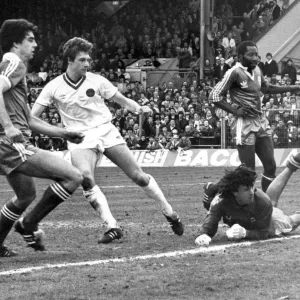 Everton footballer Kevin Sheedy score past Brighton goalkeeper Graham Mosely to give his Everton footballer Kevin Sheedy score past Brighton goalkeeper Graham Mosely to give his