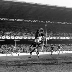 Everton v. Arsenal: West punches away corner kick from McLintockIs head with Hurst Everton v. Arsenal: West punches away corner kick from McLintockIs head with Hurst