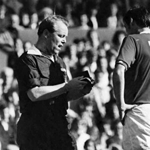 Everton v. Derby County. John Hurst booked by referee Jony Oliver. September 1971 P006197