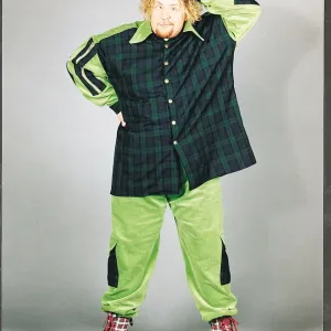 Ewan MacLeod in green and tartan suit scratching his head Ewan MacLeod in green and tartan suit scratching his head