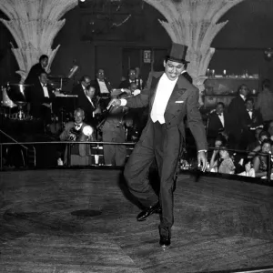 Ex - boxer Sugar Ray Robinson entertaining at a show business party in London Ex - boxer Sugar Ray Robinson entertaining at a show business party in London